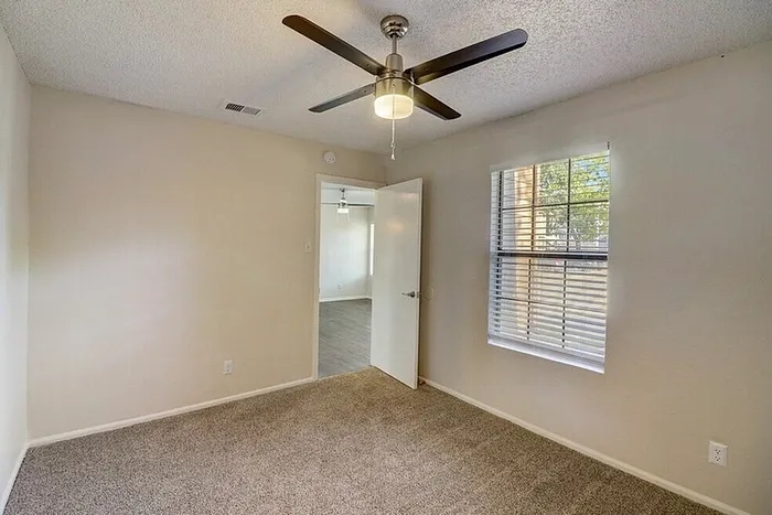 B1 primary bedroom with natural light
