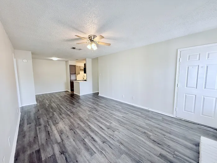 C1 living and dining area with plank-style flooring