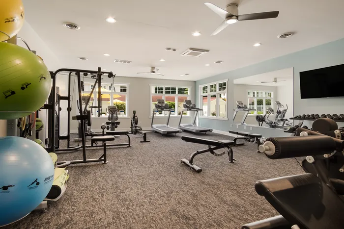 Fitness Center with exercise machines at Liv Wildwood apartments in Ludington, Michigan.