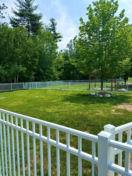 Bark park with agility course at Liv Wildwood apartments in Ludington, Michigan.