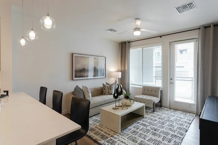 Phoenix, AZ Pet-Friendly Senior Apartments - Liv+ Union Peak - Modern, Spacious Living Area with Ceiling Fan, Open Layouts, and Smart Home Technology.