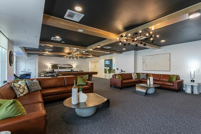 Stylish lounge area with elegant leather sofas, modern lighting, and decorative accents  | Liv+ Union Peak | Phoenix, Arizona