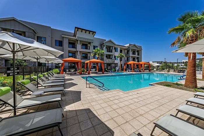 Two-Bedroom Senior Apartments In Phoenix, AZ - Liv+ Union Peak - Luxurious Heated Pool With Stylish Cabanas And Stylish Lounge Chairs.