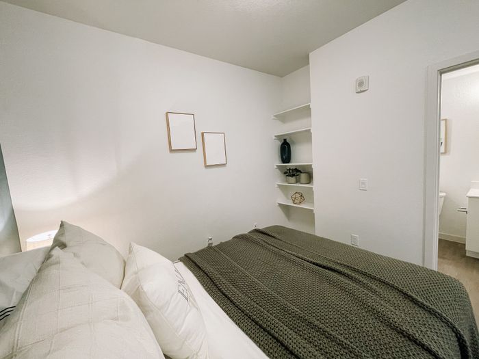 Colfax style unit bedroom area with bathroom off bedroom
