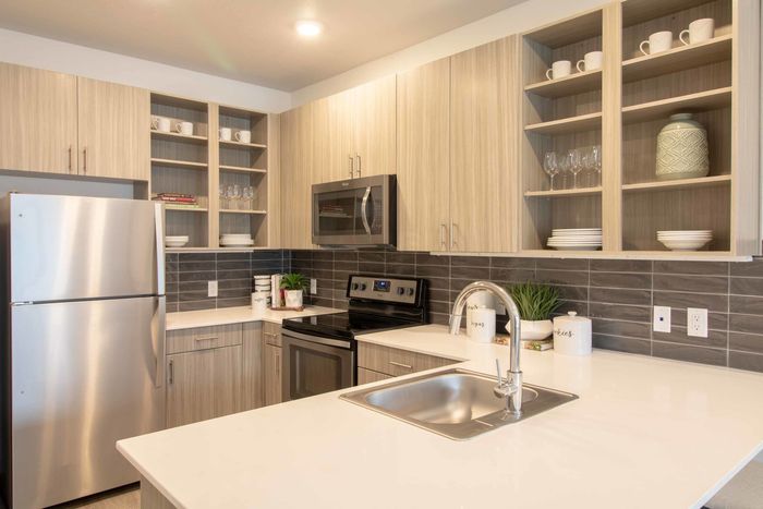 Kitchen with stainless appliances and quartz countertops