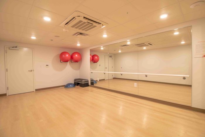 Yoga studio with a large workout mirror