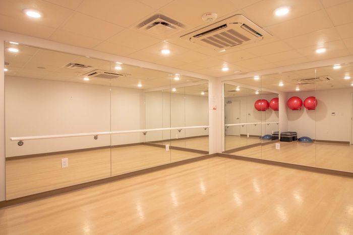 Yoga studio with a large workout mirror