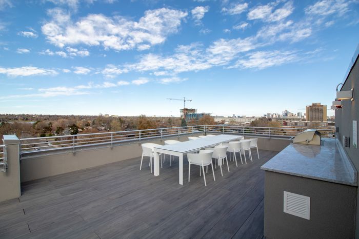 rooftop lounge with seating space overlooking Downtown Denver