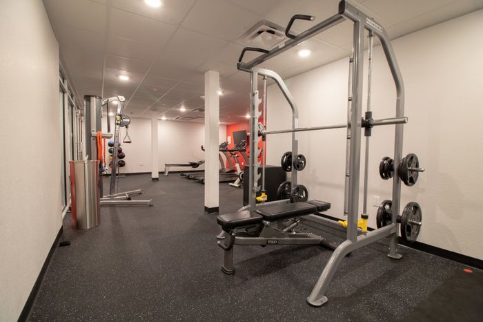 Fitness center with a bench press machine