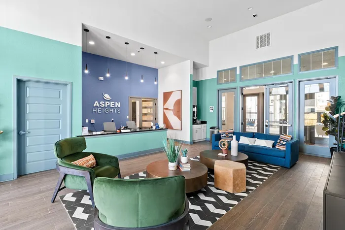 Modern lobby area of Aspen Heights with stylish furniture, bright colors, and welcoming design.