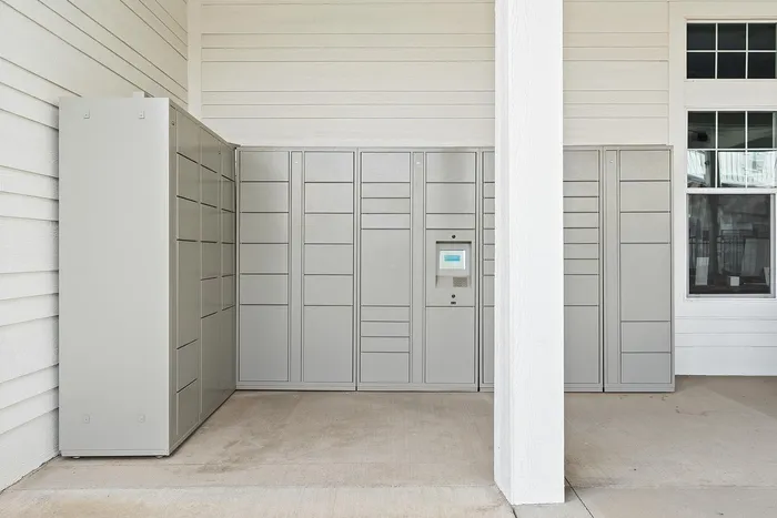 Modern package locker system integrated into apartment building design.