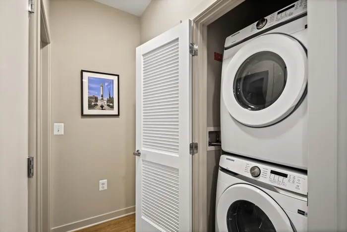 Washer and dryer in a tidy laundry room at Lofts at Yard 56.