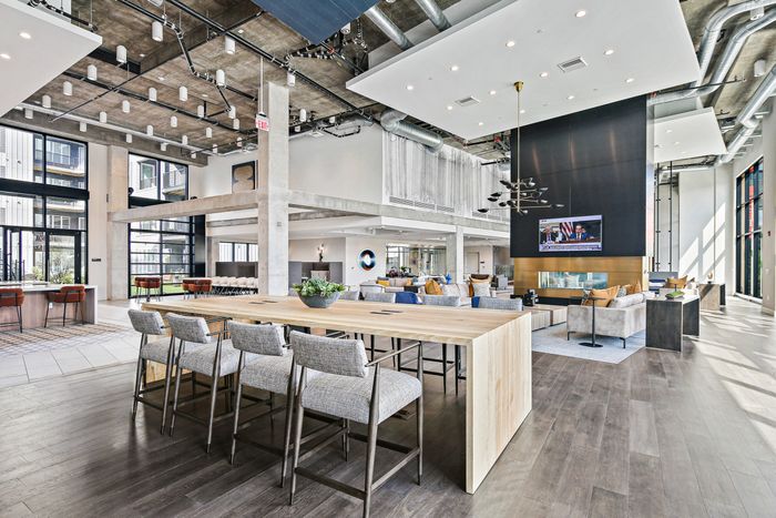 Contemporary office features spacious kitchen and dining area at Lofts at Yard 56.