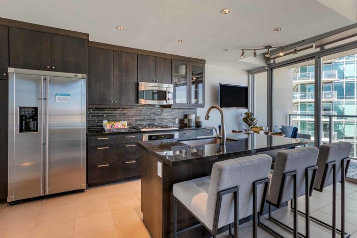 model unit kitchen with appliances and chairs west 6th tempe