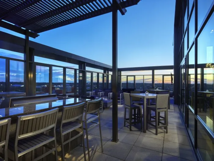 outdoor seating area with tvs and fire place six11 ann arbor