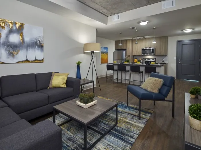 model unit living area with couches and chair six11 ann arbor
