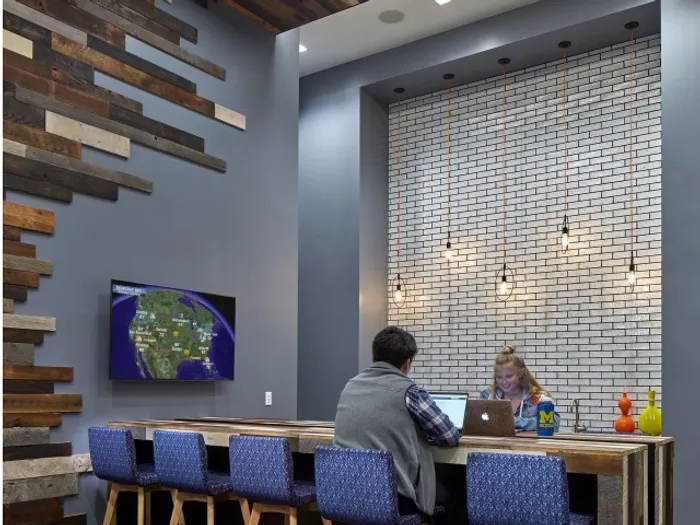 study area with tvs and long tables six11 ann arbor