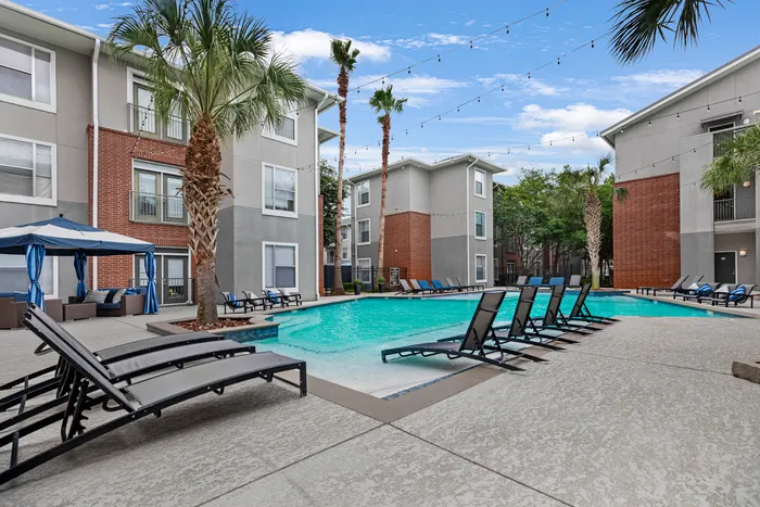 pool area with chairs and umbrellas campus crossings on highland baton rouge