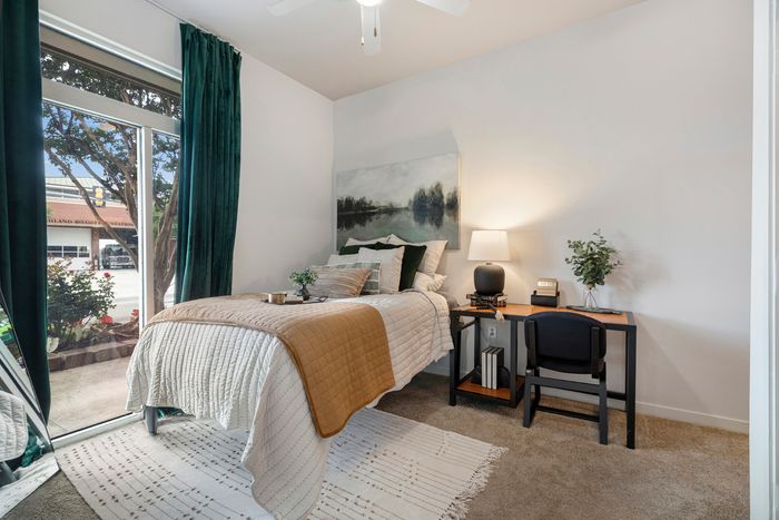 large bathroom in with bed and desk highland apartment
