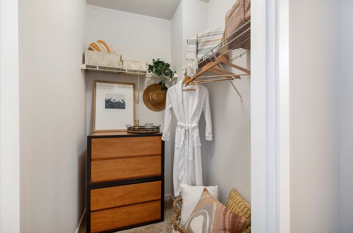 model unit closet with dresser and robe. campus crossings on highland baton rouge