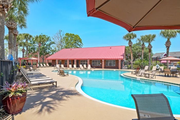campus crossings alafaya pool area with lounge chairs