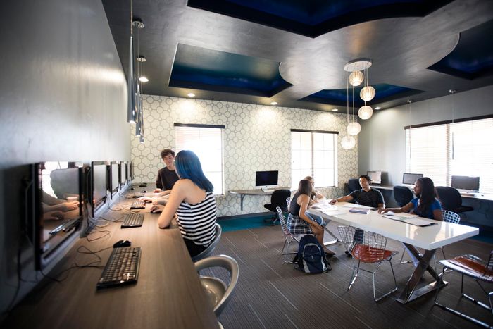 campus crossing at star pass cyber lounge area with people talking and meeting