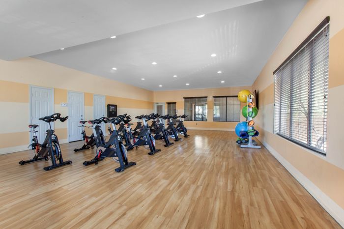 campus crossings at star pass fitness center with exercise bikes and medicine balls