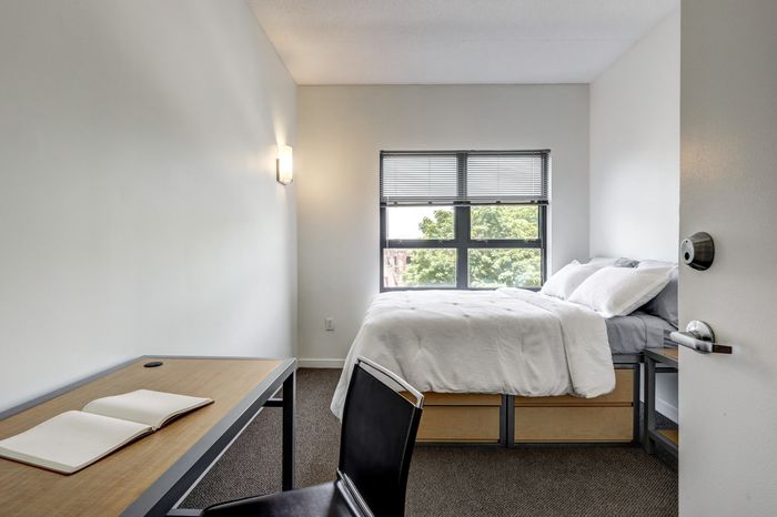 campus crossing at college row model unit bedroom with bed and desk. lancaster pa franklin & marshall