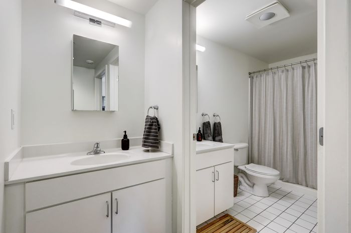 campus crossing at college row model unit bathroom with exterior sink, toilet, and shower. lancaster pa franklin & marshall