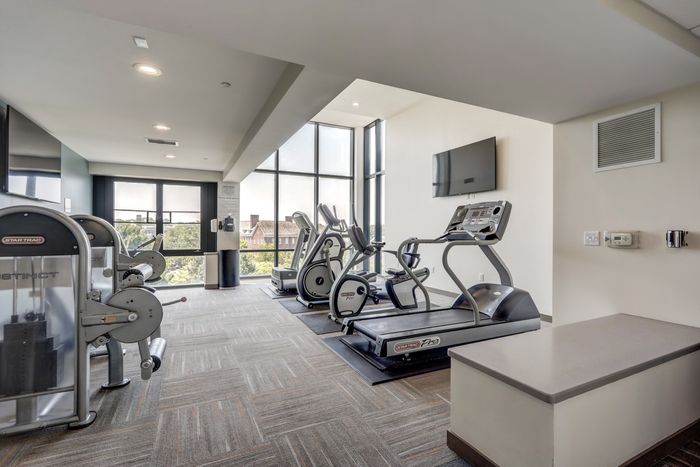 campus crossings at college row fitness area with treadmills, ellipticals, and leg machines. lancaster pa franklin & marshall.
