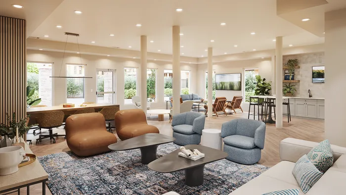 renovated resident lounge seating area with couches, and chairs.