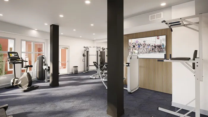 campus crossings briarcliff renovated fitness enter with bikes, pull up machine, and tvs.