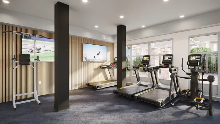 campus crossings briarcliff renovated fitness center with treadmills, elliptical, and pull up machine.