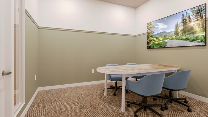campus crossings briarcliff private conference room with tvs, chairs, and tables.