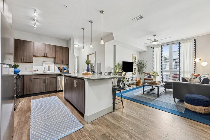 tenn student living knoxville model unit kitchen with island and stainless steel appliances