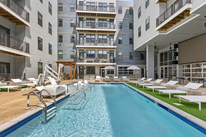 tenn student living knoxville pool area with loungers