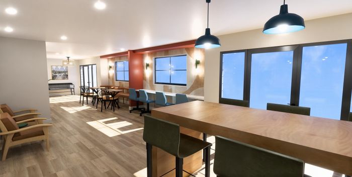Bright and modern open-plan space featuring stylish dining and seating areas with large windows, perfect for social gatherings.