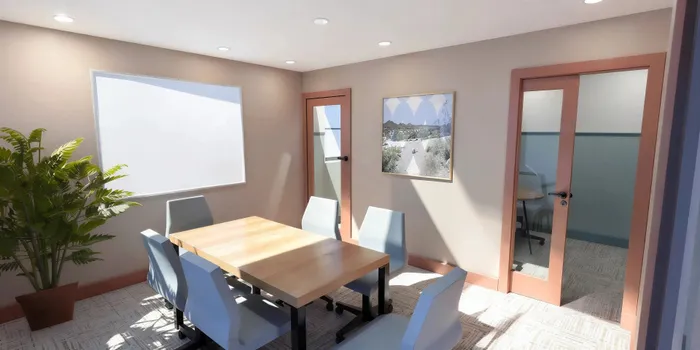 Bright and modern conference room with sleek wooden table, stylish chairs, and natural light enhancing the space.