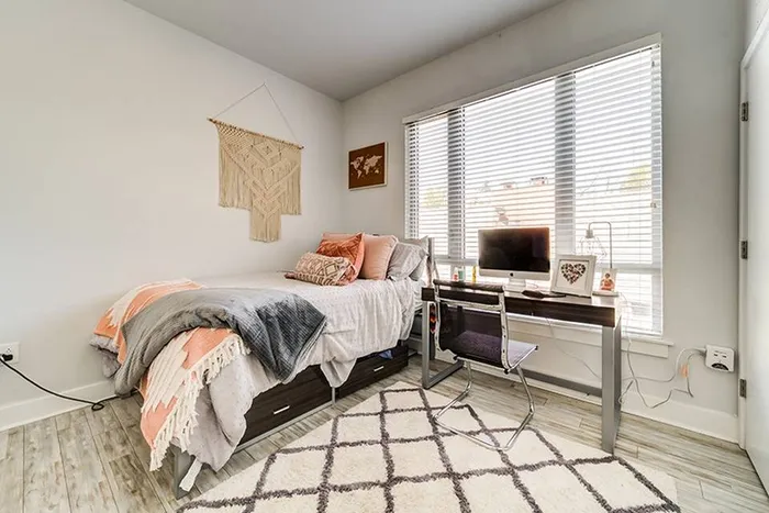 Fully furnished bedroom at Live on Hillsborough in Raleigh, North Carolina