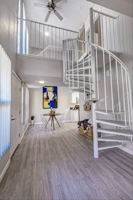 Living Room with Spiral Staircase and Vaulted Ceilings at 225 North in Tucson, Arizona