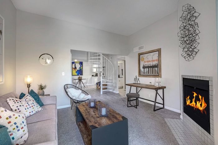 Living Room with Fireplace and Spiral Staircase at 225 North in Tucson, Arizona
