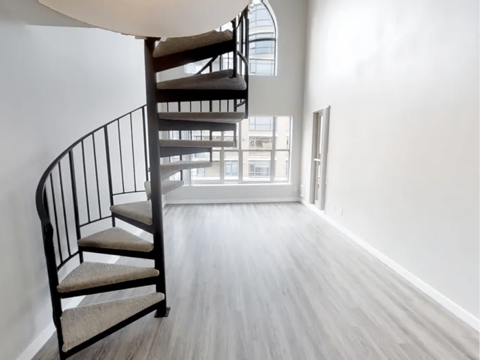 Loft apartment with spiral staircase at Avanti in Seattle, WA