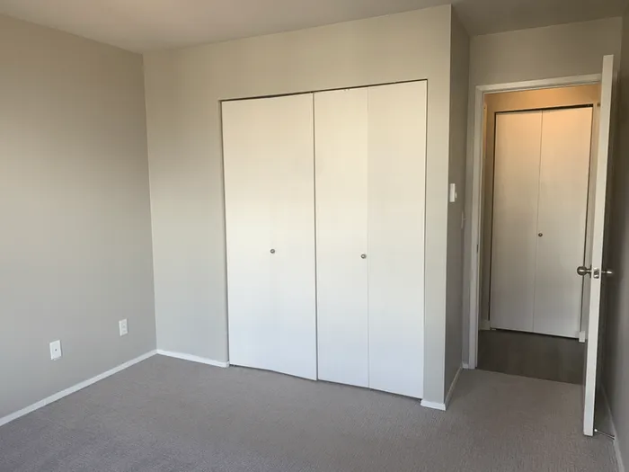 Bedroom with closet at Avanti in Seattle, WA