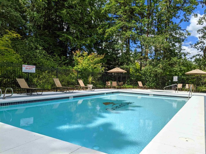 Swimming pool and hot tub at Grand Oaks apartment community in Corvallis, Oregon.