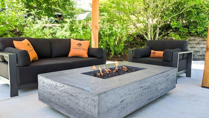 Fire pit lounge area for relaxation at Grand Oaks apartment community in Corvallis, Oregon.