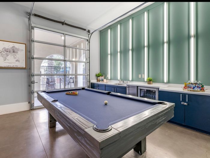 Social game room with pool Table at Highlander at North Campus in Riverside, California