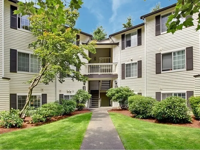 Greystone Meadows apartment building exterior with greenery in Federal Way WA