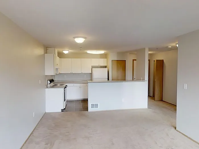 Spacious Kitchen and Living Room at North Admiral apartment community in Seattle, WA