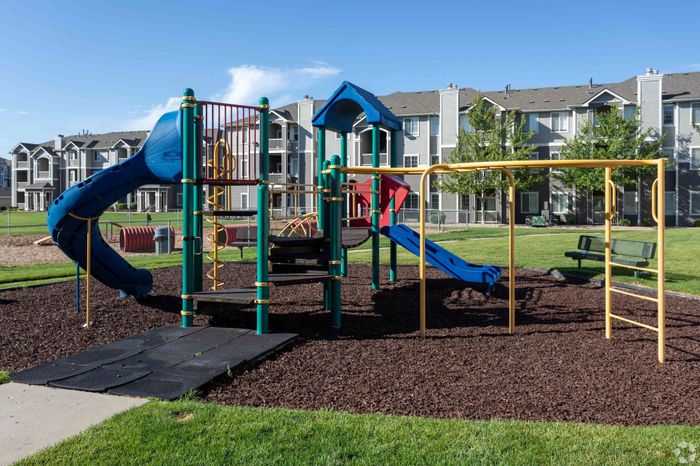 Playground at Pinnacle Mountain View apartments in Clearfield, UT