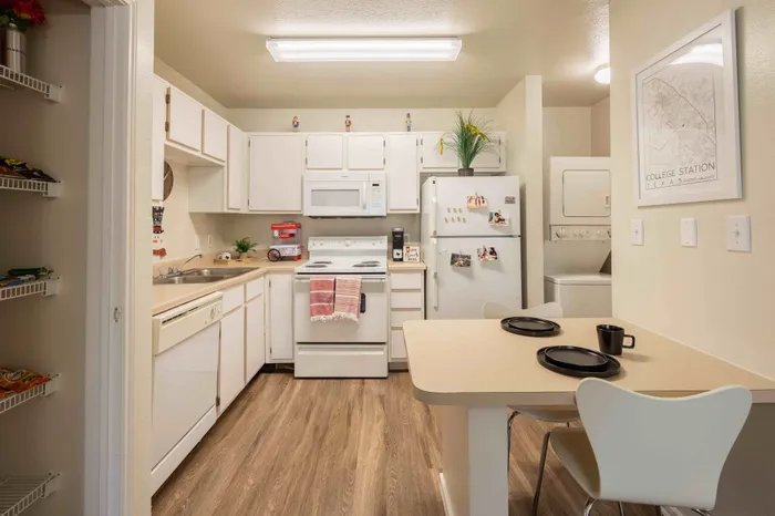 Open kitchen and dining area at The Zone student apartments near Texas A&M University in College Station Texas